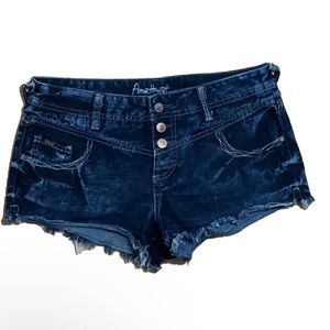Amethyst Jeans dark blue button shorts. Low rise with big pockets on the back.